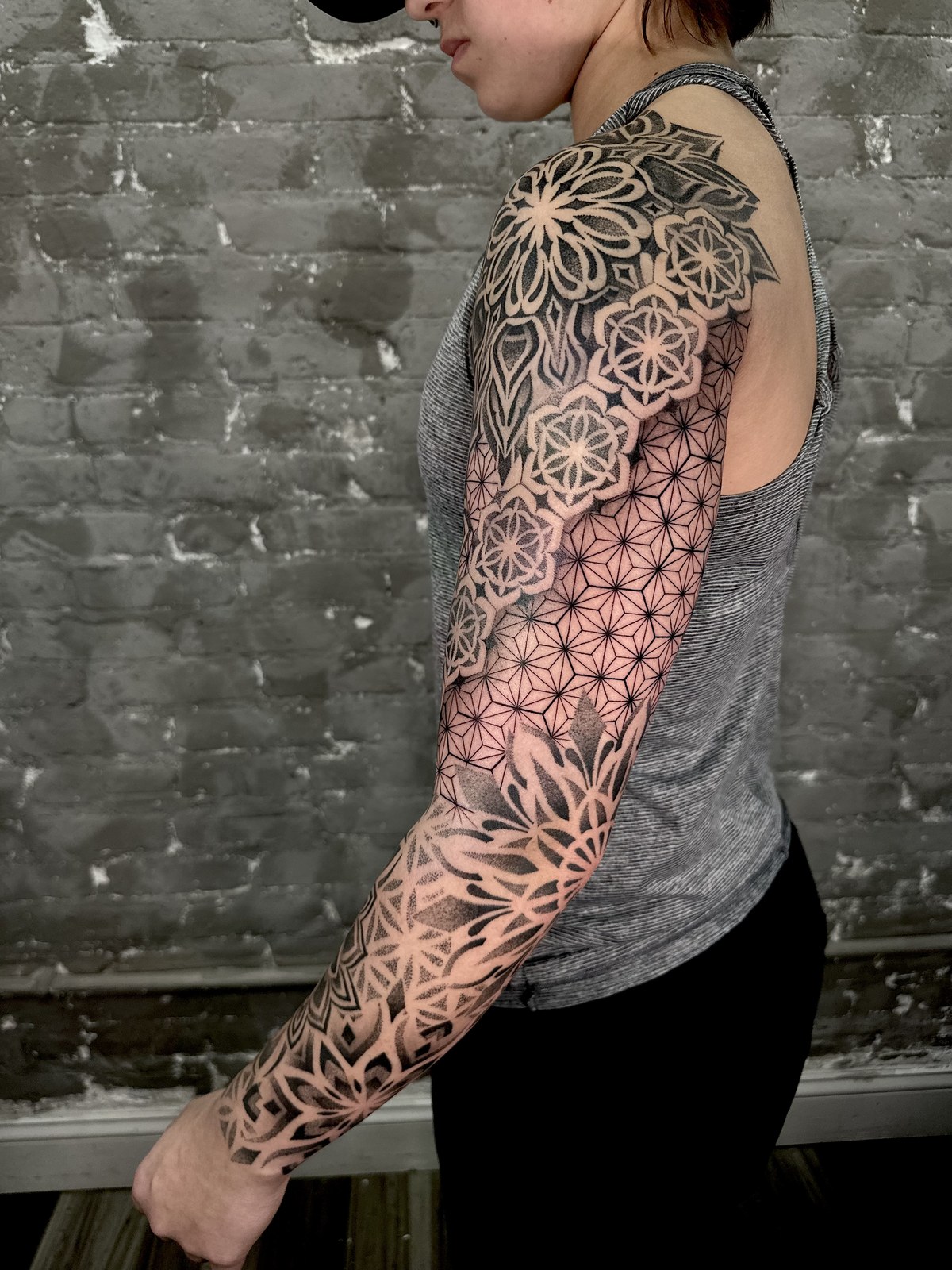Geometric blackwork sleeve tattoo