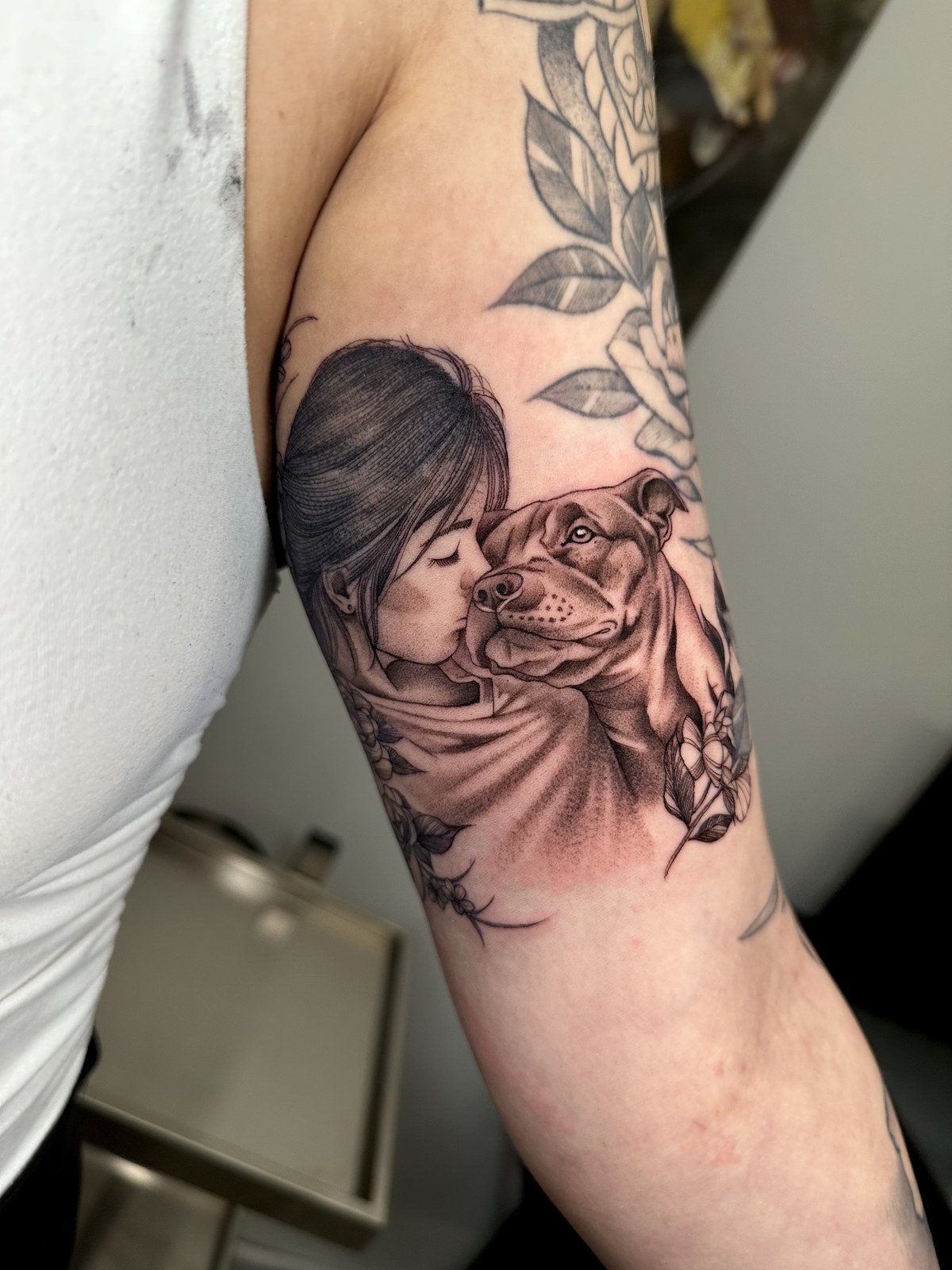 Portrait tattoo of a woman and dog